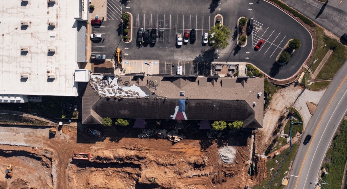 Aerial view of a commercial shingle roof tear-off