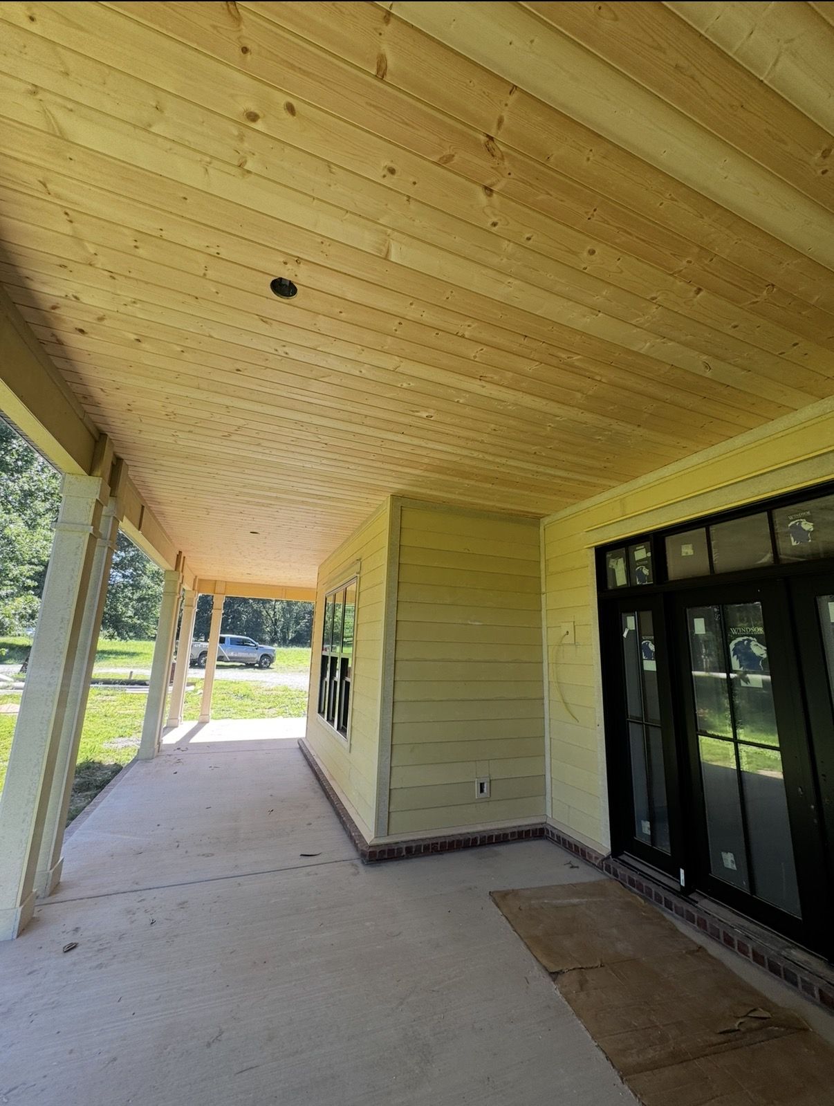 Pine tongue-and-groove porch ceiling with Hardie siding in Fayetteville